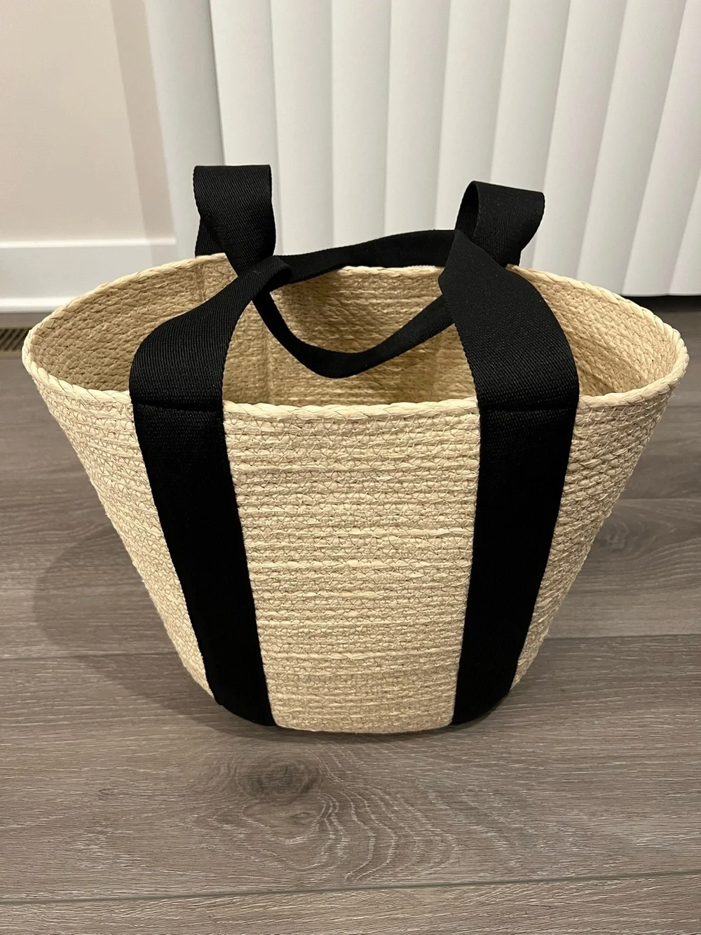Straw Rope Woven Market Basket Tote w/ Black Handles. 12” tall x 15.5” wide.